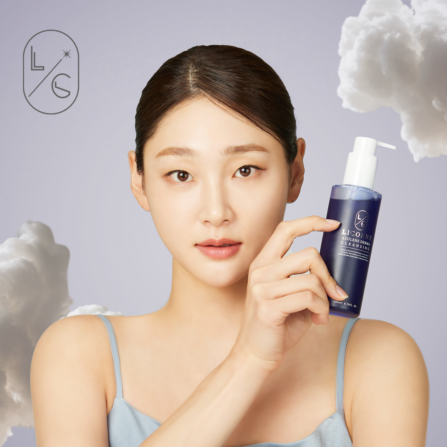 Woman holding a skincare product with a soft, neutral background