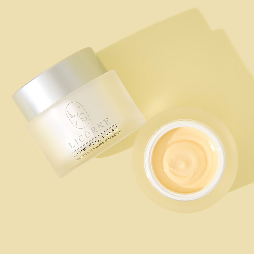 Licorne skincare cream jar with open lid on a light yellow background