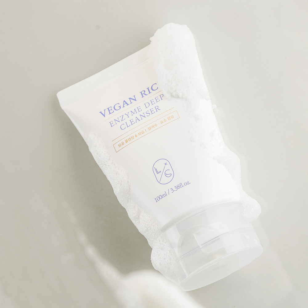 White skincare product packaging with 'Vegan Rice' branding on a light background