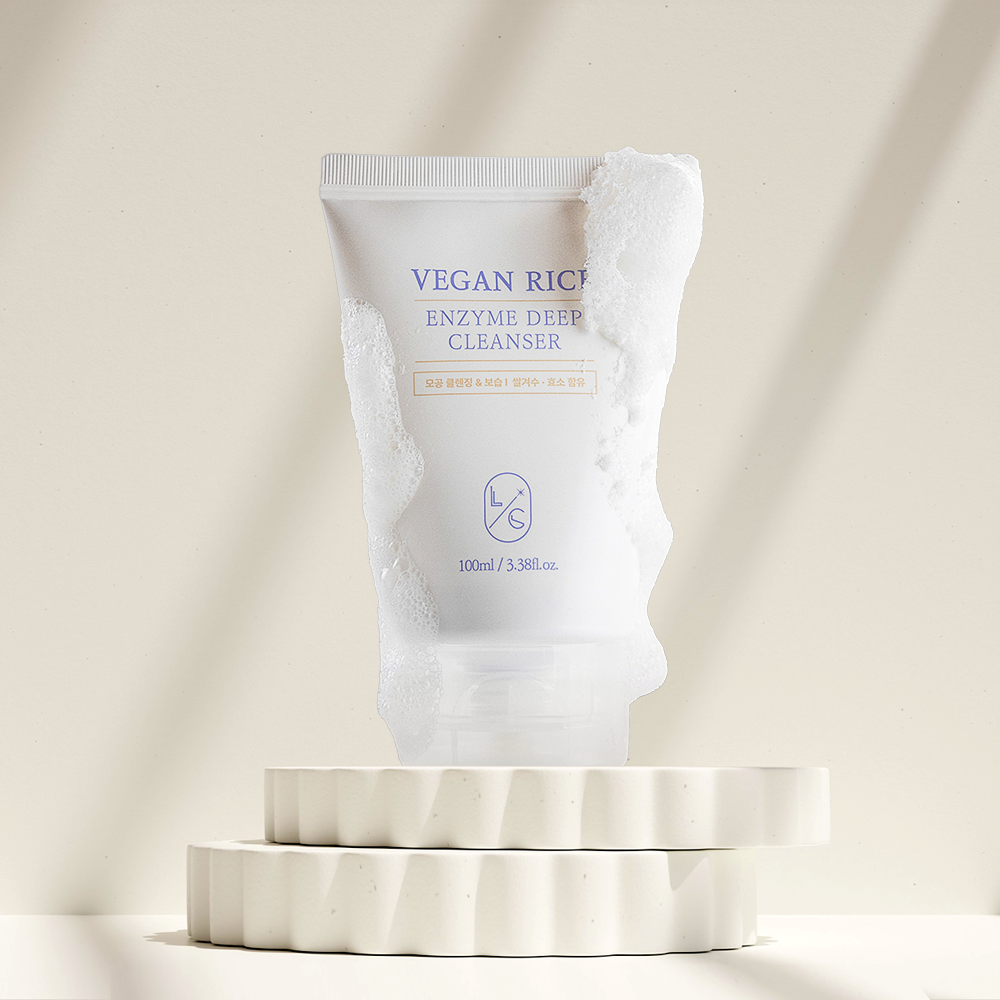 Vegan Rice Enzyme Deep Cleanser packaging on a beige background