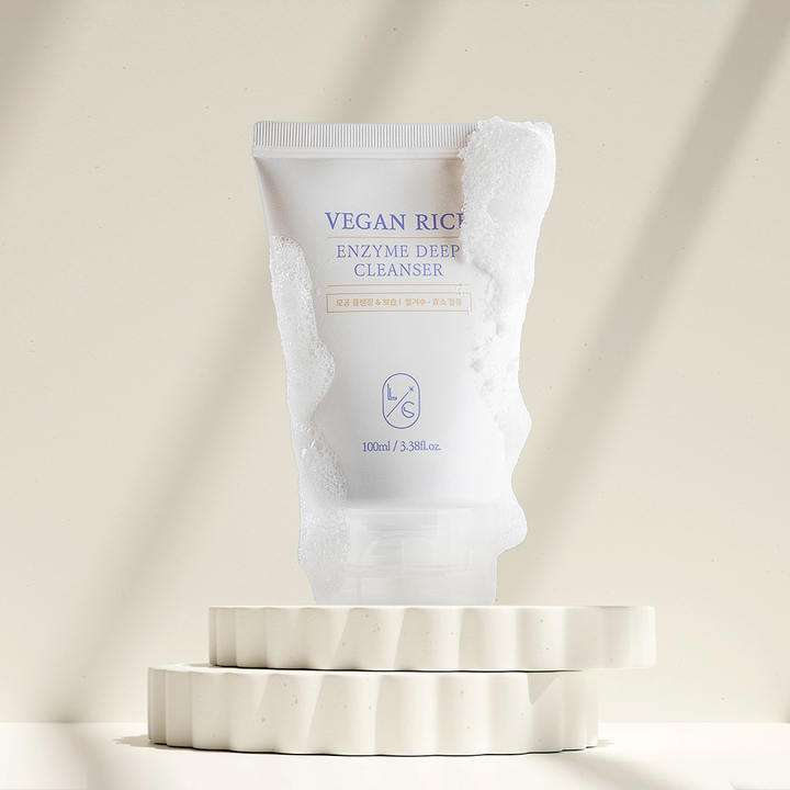 Vegan Rice Enzyme Deep Cleanser packaging on a beige background
